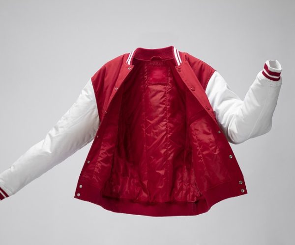 image says polyester jacket in white and red color.